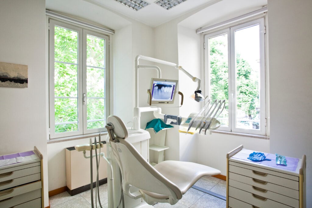 Independent dental practice owner reviewing supply costs and GPO membership options